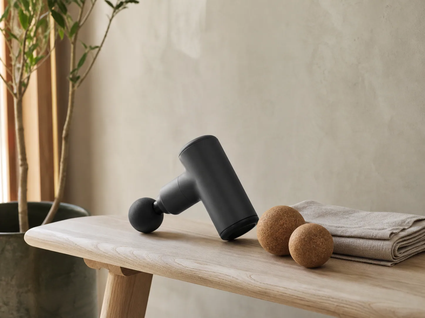 Percussion device and cork mobility tools on an oak bench